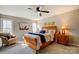 Inviting main bedroom features a ceiling fan and ample natural light at 7306 Timbercreek Ct, Denver, NC 28037