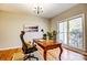 Home office with a large window, desk, and natural lighting at 7306 Timbercreek Ct, Denver, NC 28037