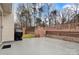 View of the backyard and wood patio at 8808 Shady Pine Ct, Charlotte, NC 28214