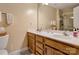 Bright bathroom featuring double sinks and a glass door shower at 8808 Shady Pine Ct, Charlotte, NC 28214