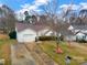 The exterior view of the house showing the garage and front yard at 8808 Shady Pine Ct, Charlotte, NC 28214