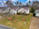 Inviting home boasts landscaped yard, manicured beds, and a well-maintained exterior with a single-car garage at 8808 Shady Pine Ct, Charlotte, NC 28214