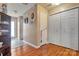 A hallway showing a closet and a cabinet for storage at 8808 Shady Pine Ct, Charlotte, NC 28214