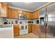 Well-equipped kitchen with stainless steel appliances, ample storage space, and a bright, airy ambiance for cooking at 8808 Shady Pine Ct, Charlotte, NC 28214