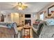 Cozy living area with hardwood floors, ceiling fan, and an open layout perfect for gathering with Gathering and friends at 8808 Shady Pine Ct, Charlotte, NC 28214