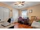 An office space featuring hardwood floors, two closets, and a granite desk at 8808 Shady Pine Ct, Charlotte, NC 28214