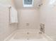 Bright bathroom with a skylight and deep soaking tub for relaxation at 9128 Kings Canyon Dr, Charlotte, NC 28210