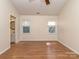 Spacious bedroom with two bright windows and attractive hardwood flooring at 9128 Kings Canyon Dr, Charlotte, NC 28210