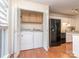 Convenient laundry area with modern washer and dryer, alongside the kitchen at 9128 Kings Canyon Dr, Charlotte, NC 28210