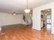 Open floor plan with hardwood floors, kitchen and staircase at 9128 Kings Canyon Dr, Charlotte, NC 28210