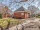 View of pool house with brick facade at 9128 Kings Canyon Dr, Charlotte, NC 28210