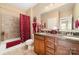 Bathroom with tub and shower, vanity, and warm, neutral color palette at 9795 Shearwater Nw Ave, Concord, NC 28027