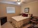 Cozy bedroom featuring a comfortable bed, neutral walls, and a ceiling fan with light at 105 Brickyard Rd, Fort Mill, SC 29715