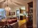 Inviting dining room featuring hardwood floors, classic lighting fixture, and seamless access to the kitchen at 105 Brickyard Rd, Fort Mill, SC 29715