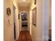 Inviting hallway with hardwood floors and a view into the bedroom at 105 Brickyard Rd, Fort Mill, SC 29715