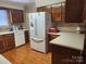 Functional kitchen equipped with stainless steel refrigerator and modern appliances, providing ample storage and counter space at 105 Brickyard Rd, Fort Mill, SC 29715