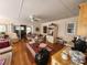 An open floor plan showcases a dining area and living space with hardwood floors and a view to the outside at 105 Brickyard Rd, Fort Mill, SC 29715