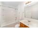 Bright bathroom featuring a shower-tub combo, modern fixtures, and a vanity with a mirror at 10530 Stoneacre Ct, Pineville, NC 28134