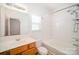 Well-lit bathroom with tiled tub and shower, vanity, updated fixtures and a bright, airy feel at 10530 Stoneacre Ct, Pineville, NC 28134