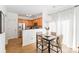 Bright dining area with views into the modern kitchen, showcasing a practical and stylish living space at 10530 Stoneacre Ct, Pineville, NC 28134