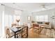 Stylish dining and living area with hardwood floors, neutral decor, and ample natural light at 10530 Stoneacre Ct, Pineville, NC 28134