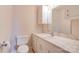 Traditional bathroom with marble countertop, toilet and white cabinet at 11 Heritage Ln, Shelby, NC 28150