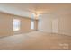 Bright bedroom with neutral carpet, ceiling fan, and two windows for natural light at 11 Heritage Ln, Shelby, NC 28150