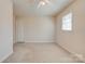 Bedroom with a white ceiling fan, neutral walls, and a large window, filled with natural light at 11 Heritage Ln, Shelby, NC 28150