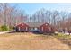 Charming, one-story brick home with a well-maintained lawn and mature trees at 11 Heritage Ln, Shelby, NC 28150
