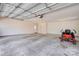 Spacious garage with overhead door, white walls, and built-in storage cabinets along the back wall at 11 Heritage Ln, Shelby, NC 28150