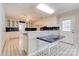 Classic kitchen featuring white cabinets, blue countertops, and vintage-inspired flooring at 11 Heritage Ln, Shelby, NC 28150
