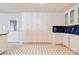 Spacious kitchen boasts ample white cabinetry and geometric patterned tile flooring at 11 Heritage Ln, Shelby, NC 28150