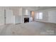 Bright living room featuring a fireplace, built-in cabinets, and lots of natural light at 11 Heritage Ln, Shelby, NC 28150