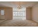 Open-concept living room with large windows, chandelier and abundant natural light at 11 Heritage Ln, Shelby, NC 28150