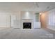 Cozy living room with a fireplace, built-in cabinets and carpet flooring at 11 Heritage Ln, Shelby, NC 28150