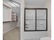 Bathroom showcasing a black framed glass shower and closet at 1114 Roderick Dr, Fort Mill, SC 29708