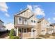 Charming two-story home featuring stone accents, a one-car garage, and a covered front porch, ideal for relaxing at 1114 Roderick Dr, Fort Mill, SC 29708