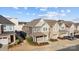 Beautiful two-story townhome with stone accents, a covered porch, and a private driveway at 1114 Roderick Dr, Fort Mill, SC 29708