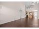 Bright and airy living room with high ceilings, dark wood floors, and an open staircase at 1114 Roderick Dr, Fort Mill, SC 29708