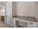 A convenient desk area with granite countertop provides additional space for working or studying at 1114 Roderick Dr, Fort Mill, SC 29708