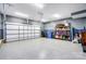 Spacious garage featuring epoxy flooring, garage door opener, and added storage at 118 Isleworth Ave, Mooresville, NC 28117