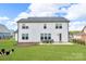 Spacious backyard featuring a well-manicured lawn and charming patio, ideal for outdoor gatherings at 122 Round Rock Rd, Troutman, NC 28166
