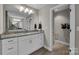 Bathroom featuring granite countertops, white cabinets, and neutral walls and floors at 122 Round Rock Rd, Troutman, NC 28166