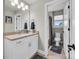 Bright bathroom features a vanity with a granite countertop and a view into a second bathroom at 122 Round Rock Rd, Troutman, NC 28166
