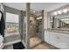 Modern bathroom featuring a glass shower with custom tile work and granite countertop vanity at 122 Round Rock Rd, Troutman, NC 28166
