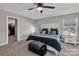 Comfortable bedroom with a ceiling fan, large bed, three windows and neutral wall paint at 122 Round Rock Rd, Troutman, NC 28166
