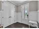 The foyer features dark wood flooring and elegant white wainscoting at 122 Round Rock Rd, Troutman, NC 28166