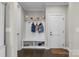 A convenient mud room with built-in storage and coat hooks at 122 Round Rock Rd, Troutman, NC 28166