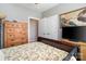 Bedroom with a queen bed, light walls, and wood dresser with television at 1249 Maddy Ln, Rock Hill, SC 29732