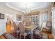 Elegant dining room with a classic chandelier, ornate furnishings, and a decorative china cabinet at 1249 Maddy Ln, Rock Hill, SC 29732